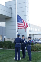 Members of the Kansas State University Air Force ROTC program raise the flag in front of Via Christi Hospital on Friday. (Photos courtesy Via Christi Hospital)
