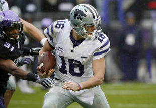 Kansas State quarterback Jesse Ertz (16) runs for a first down past TCU safety Ridwan Issahaku (31) during the first half of an NCAA college football game Saturday, Dec. 3, 2016, in Fort Worth, Texas. (AP Photo/Ron Jenkins)