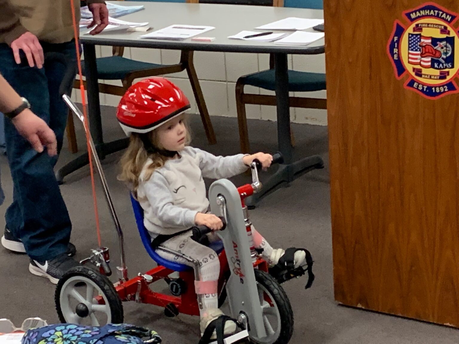 Two children with physical disabilities receive custommade tricycles
