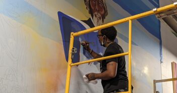 Wichita native returns to paint Douglass Activity Center mural