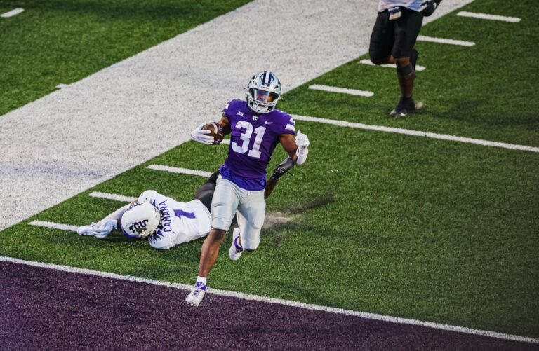 K-State's D.J. Giddens finishes off a 61 catch and run in the Wildcats' win over TCU, Oct. 21, 2023.