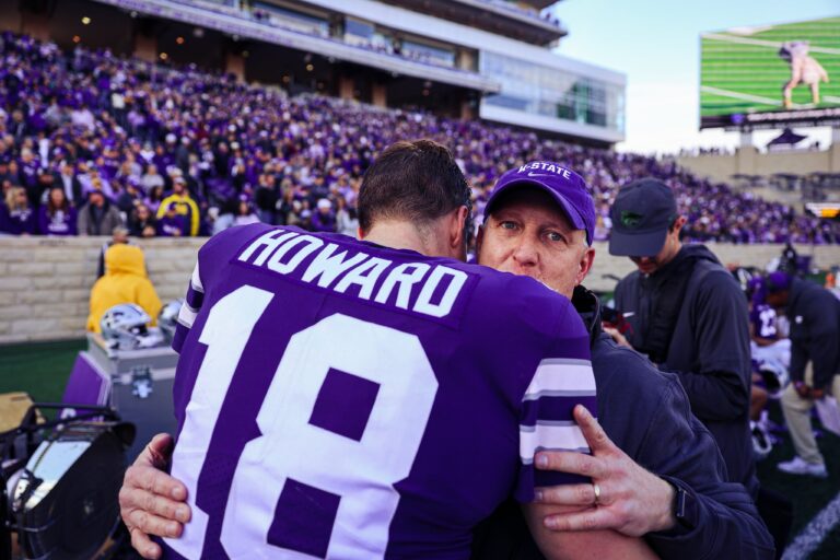 Kansas State quarterback Will Howard hugs coach Chris Klieman after throwing his school recording setting 45th career touchdown pass Saturday, Nov. 11, 2023.