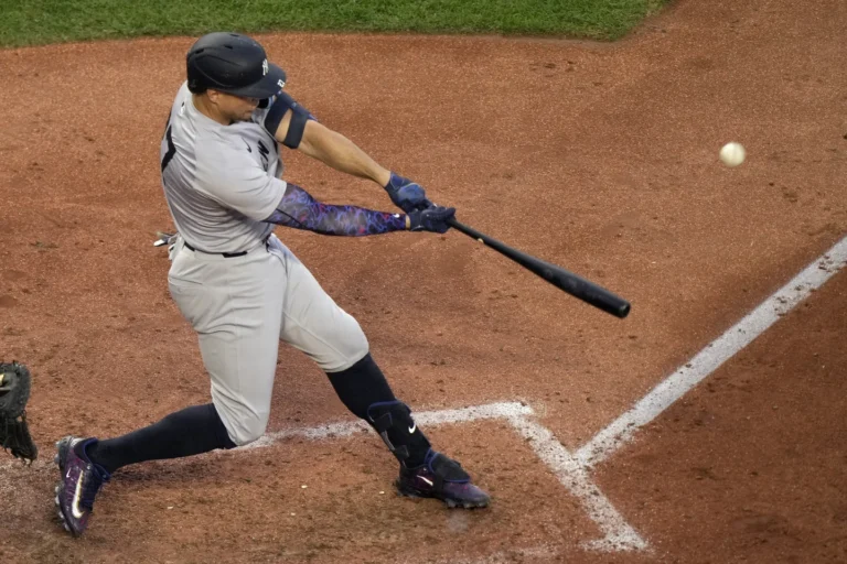 New York Yankees' Giancarlo Stanton hits a two-run home run during the fifth inning of a baseball game against the Kansas City Royals Wednesday, June 12, 2024, in Kansas City, Mo. (AP Photo/Charlie Riedel)
