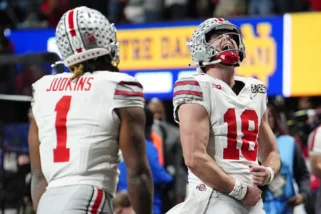 Will Howard celebrates Ohio State's CFP title victory after record-setting performance